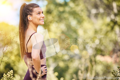 Image of Wellness, fitness and woman in nature smile to enjoy fresh air after running, marathon training and workout. Sports, motivation and happy girl in park for zen wellness, cardio and healthy lifestyle