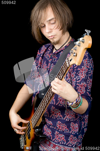 Image of The young man with a guitar. Isolated