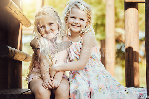 Image of Portrait, children and girl siblings outdoor together at a park during summer vacation or holiday. Family, kids and love with a female child and sister hugging while bonding outside or having fun