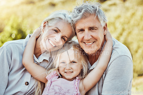 Image of Grandparents, girl and smile portrait in a family outdoor park happy about a picnic. Children, happiness and kids with elderly grandparent in garden or backyard smiling and bonding together in nature