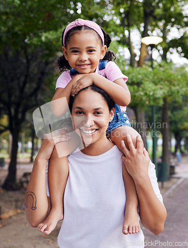 Image of Family, mom and kid in portrait, outdoor in park and fun day in nature with love, care and happy people together. Girl on woman shoulders, happiness and bonding with adventure and content with smile