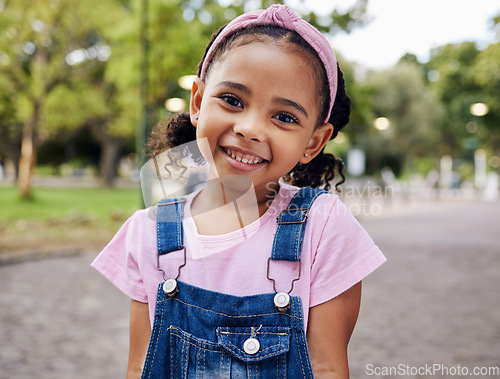 Image of Portrait, young girl and smile in park, happy child outdoor with nature and freedom with positive mindset. Travel, happiness and adventure, growth and childhood with family day out and youth mockup