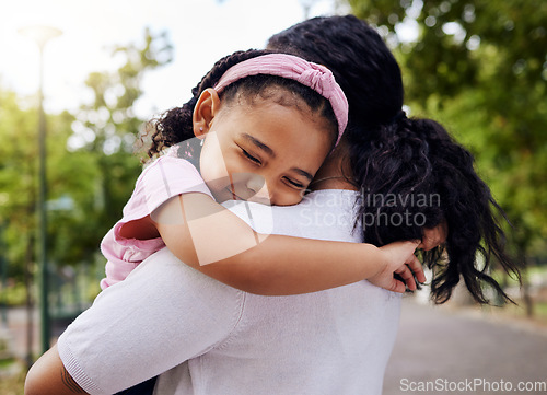 Image of Hug, park and mother and daughter, love and sweet while bonding outdoor together. Black woman, embrace and fun in a forest, precious and happy, content and relax in a beautiful moment of motherhood