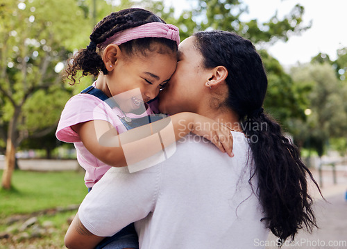 Image of Mother, daughter and kiss in a park, love and sweet while bonding outdoor together. Black woman, girl and kissing face in a forest for fun, precious and happy, laugh and relax in moment of motherhood