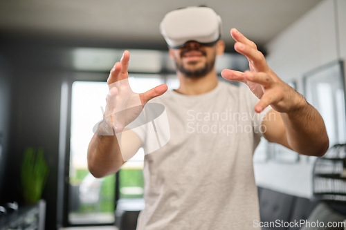 Image of Virtual reality glasses, technology and hands of man in home with headset for interactive, online and 3d games. Futuristic, user interface and male with vr for metaverse, cyberspace and gaming ux