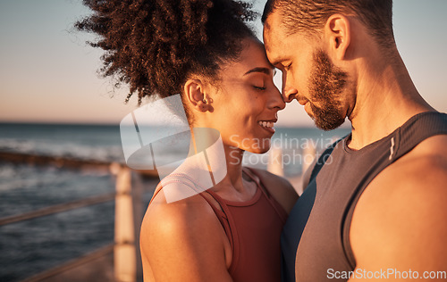 Image of Black couple, smile and hug with forehead by beach embracing relationship, compassion or love and care. Happy man and woman touching heads smiling in happiness for support, trust or romance in nature