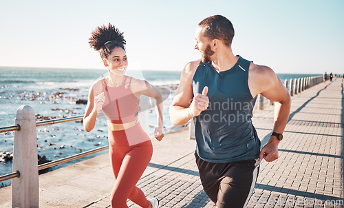 Image of Running, exercise and training with a sports couple outdoor in summer for a cardio or endurance workout. Health, fitness and ocean with a man and woman runner on a promenade for a challenge together