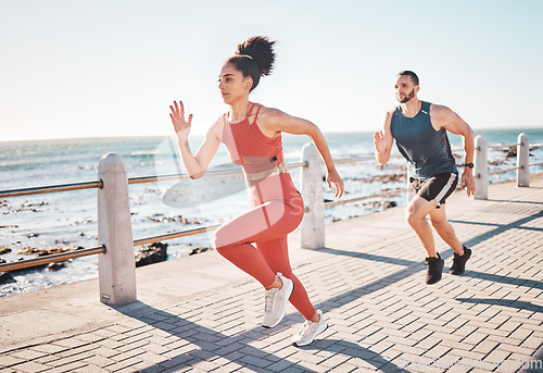 Image of Running, fitness and ocean with a sports couple outdoor during summer for cardio or endurance exercise. Health, training and sea with a man and woman runner on a promenade for a workout together