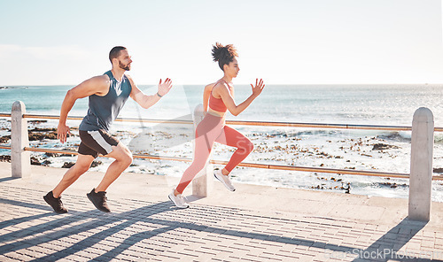 Image of Runner, fitness and sea with a sports couple outdoor during summer for cardio or endurance exercise. Health, training and ocean with a man and woman running on a promenade for a workout together