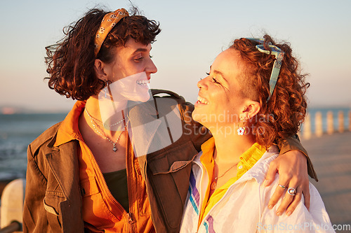 Image of Lesbian, lgbtq and couple of friends at the beach with love, hug and excited for summer holiday and date. Sunset, sea and smile of women or gay people with pride, freedom and gen z solidarity in sun