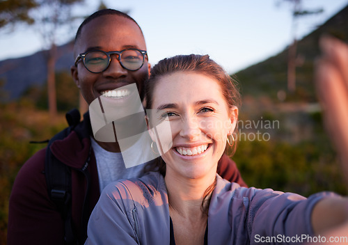 Image of Nature, selfie and portrait of interracial couple on mountain for holiday, vacation and hiking adventure on weekend. Travel, wellness and happy man with woman enjoy calm, freedom and peace at sunset