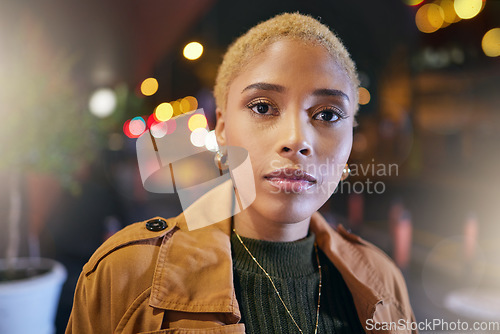 Image of Portrait, dark and woman in the city at night or evening with urban fashion, style and makeup in a town. Young, beauty and face of female feeling confident and proud in the lights outdoors