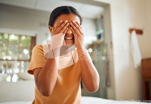 Image of Cover eyes, grooming and child in the bathroom for facial cleaning, wellness and hygiene. Health, happy and girl hiding her face for beauty, washing and clean in a house with a smile in the morning