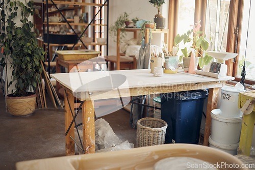 Image of Creative, art and pottery with empty room of workshop for design, manufacturing and small business. Ceramics, interior and production with table in studio of for painting, inspiration and retail