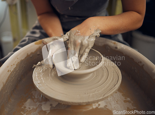 Image of Clay, pottery or hands in designer workshop working on an artistic cup or mug mold in small business studio. Hand of creative artist or worker manufacturing handicraft products in sculpture process