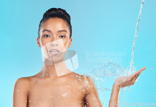 Image of Shower portrait, water and black woman cleaning with liquid mockup, hydration product placement or skincare advertising. Studio hygiene space, mock up and model washing isolated on blue background