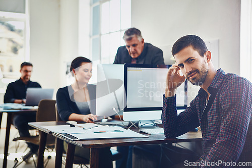 Image of Office, portrait and business man by computer in company workplace. Coworking, planning and happy male employee working on marketing report, advertising proposal or sales project with colleagues.