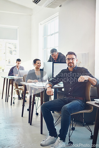 Image of Teamwork, portrait and business man in office workplace ready for targets or goals. Leadership, ceo or mature male employee or manger with coworkers working on marketing, advertising or sales project