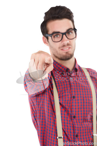 Image of Portrait, hand and man pointing in studio for you, blame and accountability against white background. Face, guy and finger gesture showing choice, direction, guilt and choosing or standing isolated