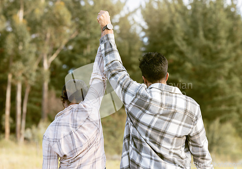 Image of Success, hiking and back of couple holding hands in forest for achievement, victory or fitness goals. Travel, freedom and man with woman celebrating milestone, journey and adventure goal in nature