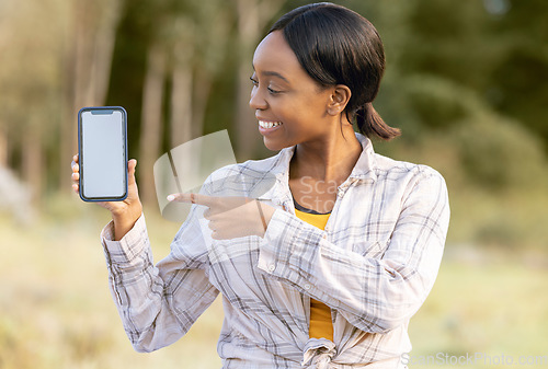 Image of Mockup screen, phone and black woman pointing at digital marketing, branding or advertising content. Outdoor, technology and person point with happiness and online on mobile with blurred background