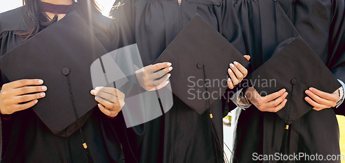 Image of University student group, hands and holding graduation cap together in queue, cropped and success for study goal. Friends, students and graduate celebration for education, learning and future career