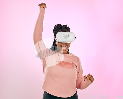 Image of Vr glasses, futuristic software and black woman winner celebration of game win in studio. Pink background, isolated and happy young person with happiness from ai, future and cyber gamer experience