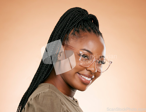 Image of Black woman, smile and retail frame portrait of a young person in a studio with happiness. Brown background, eye wellness and vision of a african female ready for lens frames choice and testing