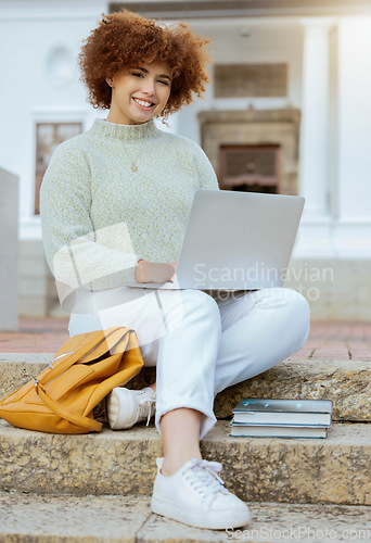 Image of Laptop, university and portrait of a woman in the city sitting on the stairs studying for test or exam. Education, happy and female college student from Brazil working on academic project on computer