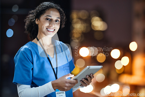Image of Tablet, city and portrait of a doctor working at night on the rooftop of the hospital building in city. Medical, lights and woman healthcare worker working late on mobile device on balcony of clinic.