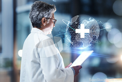 Image of Doctor, tablet and digital hologram for future healthcare, research or global innovation with technology at night clinic. Senior female medical professional with 3D touchscreen in futuristic big data