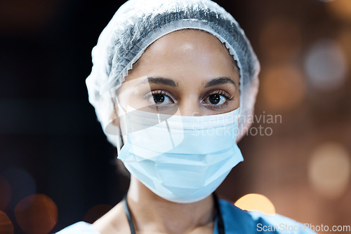 Image of Woman, doctor and portrait with face mask in night at workplace, hospital and career vision on nightshift by window. Healthcare expert, dark clinic and focus goal with ppe, safety and stop covid 19