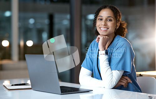 Image of Doctor, computer and black woman portrait in a healthcare office at night working on web research. Laptop, health worker and nurse with happiness from medicine analysis on technology in the dark