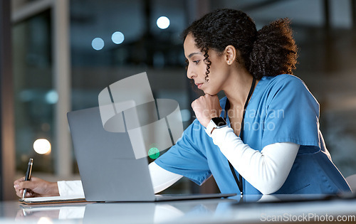 Image of Doctor, laptop and writing notes at night thinking about healthcare solution, idea or planning at hospital. Woman medical nurse working late in focus with notebook and computer for research at clinic