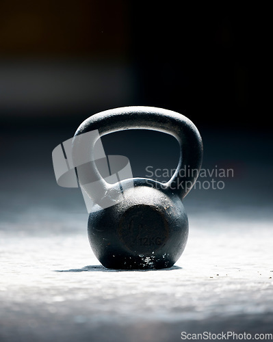 Image of Fitness, motivation or kettlebell at a gym with mockup space for strength training, exercise or workout. Zoom, metal equipment or heavy weight for strong muscle development or growth in health club