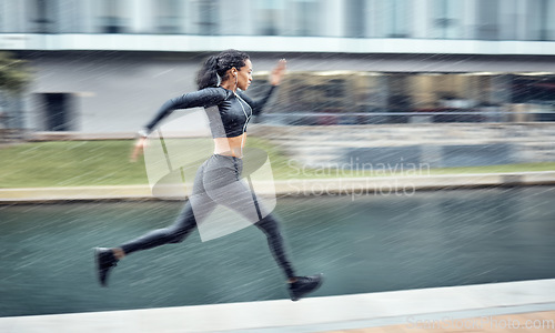 Image of Sprinting, fast and woman running in the city for fitness, training and morning energy in Germany. Exercise, sports and athlete runner with focus during outdoor cardio for body performance in motion