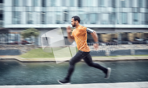 Image of Blurred, fitness and man running as exercise in the city training, workout and workout outdoors in a town. Athlete, runner and fit male sprint fast for wellness, cardio and health lifestyle