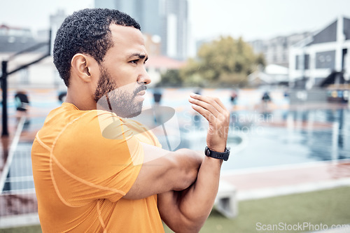 Image of Exercise, black man and stretching outdoor, focus and workout for wellness, endurance or healthy lifestyle. African American male, runner or athlete stretch arms warm up or start training for fitness
