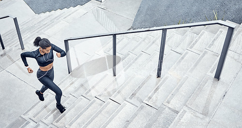 Image of Fitness, above and woman running on stairs for training, sports and body energy in the city. Challenge, exercise and runner with cardio on steps for a marathon, health and workout performance