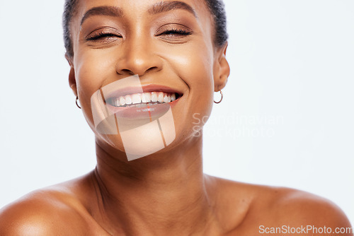 Image of Portrait, beauty and teeth with a model black woman in studio isolated on a white background for oral hygiene. Face, skincare and dental with an attractive young female posing on blank space