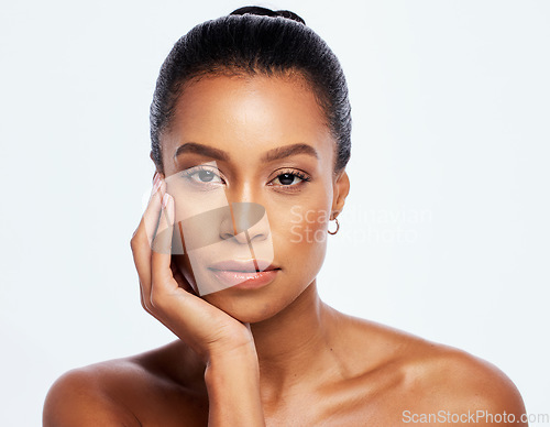 Image of Black woman, portrait and natural skincare in studio, isolated white background and beauty salon. Serious female model, face and cosmetics for aesthetic makeup, dermatology or healthy facial wellness