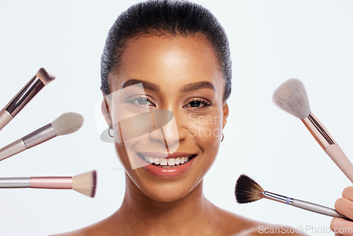 Image of Beauty, makeup and brush for face of woman portrait in studio for dermatology and cosmetics. Happy aesthetic model person with facial tools for a healthy skin glow isolated on a white background