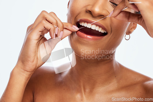 Image of Tooth, floss and black woman face, flossing for teeth whitening, healthcare and hygiene isolated on white background. Oral care product, dental and mouth cleaning for fresh breath in studio