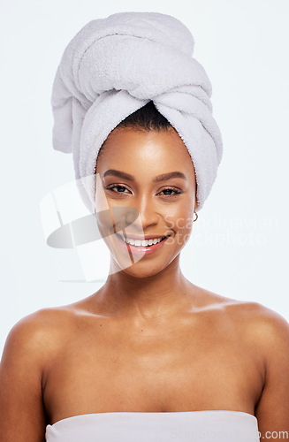 Image of Hair towel, happy woman and portrait in studio, isolated white background and face beauty. Female model, clean shower and head cloth for skincare, dermatology and bathroom cosmetics for body wellness