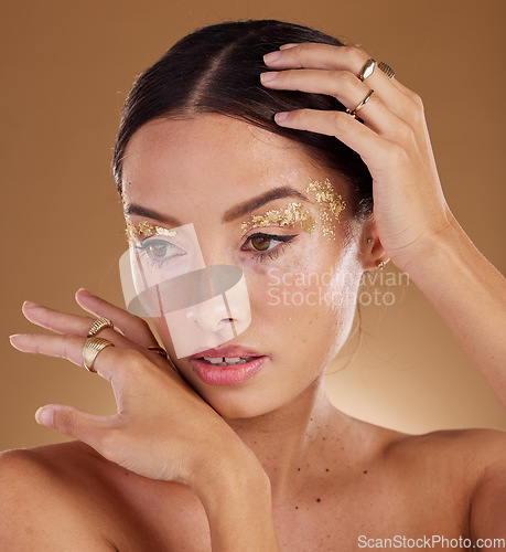 Image of Skincare, glitter and woman with cosmetics, dermatology and girl on brown studio background. Makeup, female or lady with grooming routine, natural beauty or treatment for healthy, smooth or soft skin