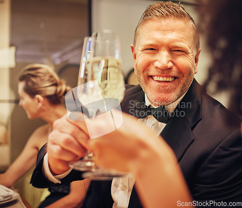 Image of Champagne, cheers celebrate and party with man in suit, smile on face at formal luxury event. Success, bubbly wine and happy people celebration of achievement or birthday, toast with glass of bubbles