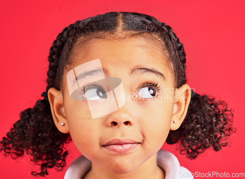 Image of Child, face and worried eyes in thinking, curious and anxiety expression on isolated red background. Zoom, headshot and kid with wondering look on studio backdrop or little girl with ideas and vision