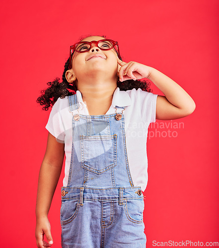 Image of Looking up, thinking or child and fashion glasses on red background in vision, optician or eyesight sales deal. Smile, happy or little girl and optometry frames, ideas or decision choice of promotion