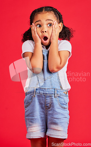 Image of Little girl, shocked or hands on face by isolated red background in kids gossip, bad news or scary children story. Surprised, anxiety or scared youth with horror facial expression, wow or emoji look