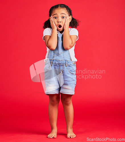 Image of Child portrait, shocked or hands on face by isolated red background in kids gossip, bad news or scary children story. Surprised, anxiety or scared girl and horror facial expression, wow or emoji look